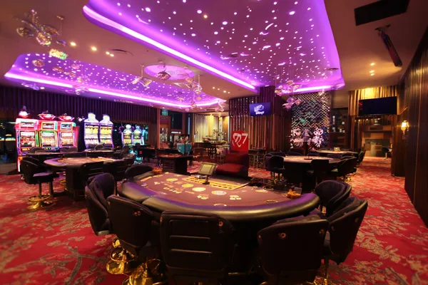 SUPERJILI Mobile App — Your complete hub for casino and sports A man focused on his laptop with live stats in the background, highlighting the dedicated sports and gaming features of the SUPERJILI mobile app.