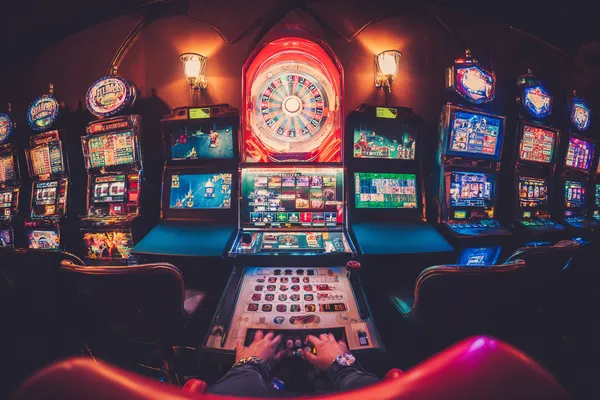 SUPERJILI Casino Games — Enjoy nonstop entertainment A close-up shot of golden coins falling around a spinning roulette wheel, representing immersive casino action at SUPERJILI.