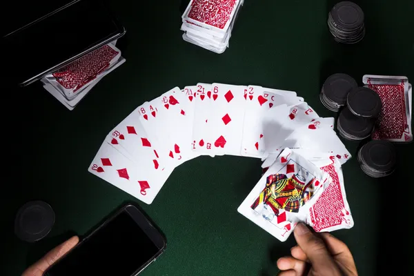 A dramatic shot of winning sevens landing on a slot reel surrounded by shining gold coins, symbolizing big wins.